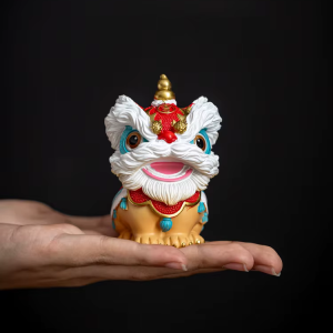 Coppia di statuette di leoni cinesi in resina