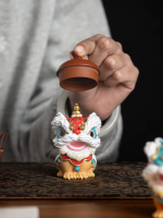 Coppia di statuette di leoni cinesi in resina
