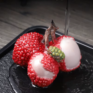 Tea pet a forma di grappolo di litchi che cambia colore
