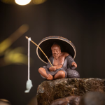 Tea pet Jiang Taigong in argilla viola con colino