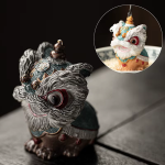 Tea pet leone termocromatico danzante in resina — Blu-verde e argento