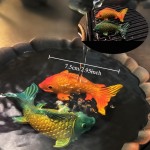 Tea pet pesci in resina con cambio di colore — Coppia arancione e verde turchese