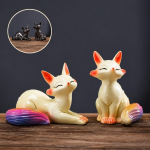 Tea pet volpe termocromico in ceramica — Coppia seduta e sdraiata