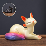 Tea pet volpe termocromico in ceramica — Una statuetta sdraiata